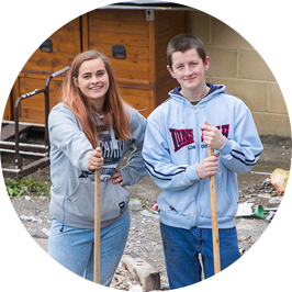 Young man and woman working outside