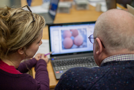 Man and woman working at a computer