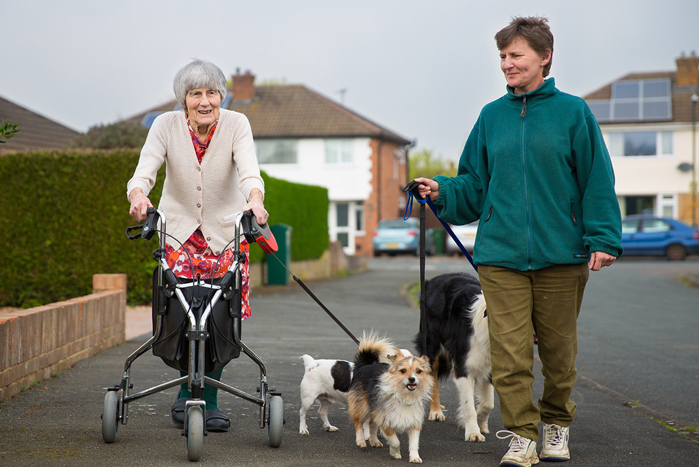 Two ladies walking dogs