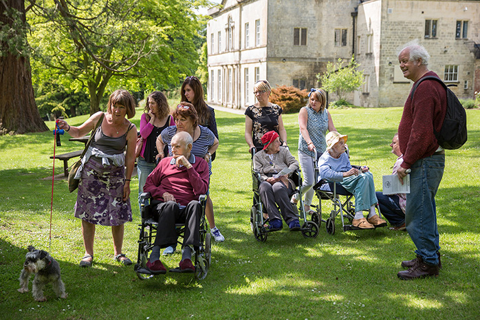 A group of elderly people with younger people