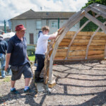 Rich overseeing some young people building a shelter at the allotment,
