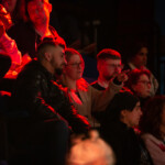 Members of the audience chatting during an intermission.