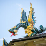 A dragon sculpture which is repeated on each corner of the pagoda.