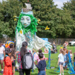 The Spirit of the Severn surrounded by a group of children.