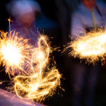 A long exposure photo with shapes being drawn with sparklers.