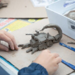 A scorpion made out of clay.
