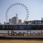 A photo of the Uber Boat with London Eye in the background.