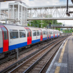 A photo of a train departing from the station.