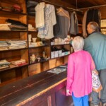 Some participants looking at clothes in an old tailors at St Fagans.
