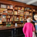Some participants pointing out products at an old grocery store at St Fagans.